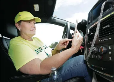  ?? (AP/Mark Humphrey) ?? Lyft driver Joni Bicknese of Nashville, Tenn., said she keeps driving because she didn’t think unemployme­nt would cover insurance and payments for her new minivan.
