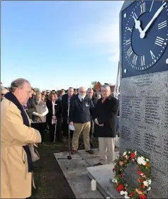  ??  ?? Dessie Morgan lays a wreath in memory of his late Granduncle, Vincie who died on the TSS Dundalk at the unveiling ceremony of a memorial to the TSS Dundalk on the Navvy Bank.