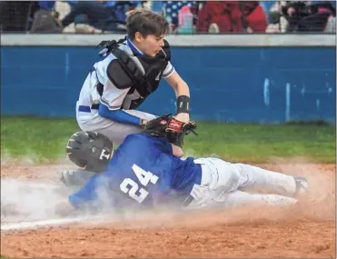  ?? Courtney Couey, Ringgold Tiger Shots ?? Ringgold catcher Isaac Crew applies a tag to a McCallie player to make an out at the plate during the Tigers’ 4-2 home win last Monday.