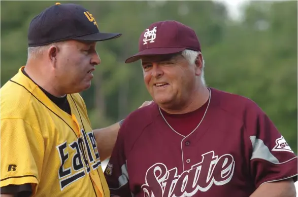  ?? (Photo by Steve Coleman, ?? Former Mississipp­i State baseball coach Ron Polk, right, visits with former Southern Miss coach Corky Palmer prior to a game in 2008.