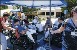  ?? IRFAN KHAN/LOS ANGELES TIMES ?? Evacuated patients rest under a tent after being evacuated from Ridgecrest Regional Hospital after Ridgecrest was hit by a 6.4 earthquake on Thursday.