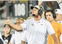  ?? WILLIE J. ALLEN JR./ORLANDO SENTINEL ?? UCF coach Gus Malzahn receives a non-binding, verbal commitment from tight end Randy Pittman of Mosley (Lynn Haven) on Saturday.