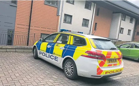  ??  ?? A police vehicle outside Wallace Court in Perth, where Mr Dixon was found in June last year.