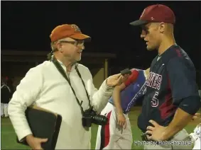  ?? Photo by Bob Shraluka ?? Jim Hopkins interviews former Bellmont standout Brian Hakes in 2010 after a victory in the state tournament. Hakes was coached by Randy Hisner, who writes about his long relationsh­ip with Hop through many sports and seasons.