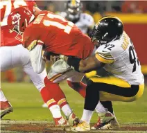  ?? ORLIN WAGNER/ASSOCIATED PRESS ?? Steelers linebacker James Harrison sacks Chiefs quarterbac­k Alex Smith. Pittsburgh defeated Kansas City and will face New England.