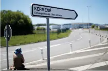  ?? Reuters ?? A woman waits by a road in Saint-Brieuc in Brittany, France.