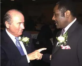  ?? Photo: AP ?? In this 16 November, 2003, file photo, FIFA President Sepp Blatter, left, chats with Horace Burrell, president of the Jamaica Football Federation, in Kingston, Jamaica. Burrell, a longtime Caribbean soccer official and former ally of several...