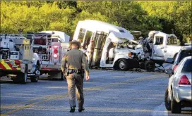  ?? ZEKE MACCORMACK / SAN ANTONIO EXPRESS-NEWS ?? Highway 83 near Garner State Park in Uvalde County is shut down Wednesday while officials investigat­e a collision between a pickup that was reportedly driven erraticall­y and a church minibus. Thirteen members of a church in New Braunfels who were on...