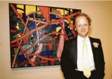  ??  ?? Perry House poses with his work during the opening of the landmark “Fresh Paint: The Houston School” exhibition at the Museum of Fine Arts, Houston in January 1985. The painter died July 8.