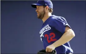  ?? AP PHOTO/GREGORY BULL ?? Los Angeles Dodgers pitcher Clayton Kershaw runs during spring training baseball on Feb. 21, in Phoenix.