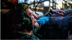  ?? (AP) ?? WAITING TO FIRE — A Ukrainian serviceman from the Azov brigade, known by the call sign Chaos, smokes a cigarette while he waits for a command to fire, in a dugout around one kilometer away from Russian forces on the frontline in Kreminna direction, Donetsk region, Ukraine, Friday, April 12, 2024.