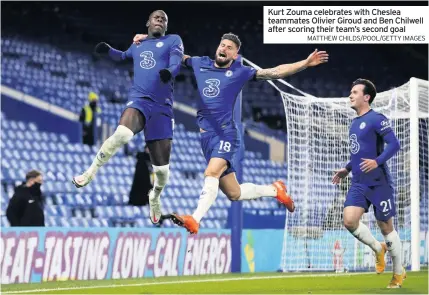  ?? MATTHEW CHILDS/POOL/GETTY IMAGES ?? Kurt Zouma celebrates with Cheslea teammates Olivier Giroud and Ben Chilwell after scoring their team’s second goal