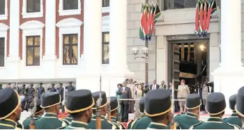  ?? African News Agency (ANA) ARMAND HOUGH ?? PRESIDENT Cyril Ramaphosa listens as a military band plays the national anthem ahead of his State of the Nation address this week.