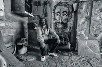  ?? ?? Glen Klaasen in his garage studio with his portrait of Emperor Haile Selassie.