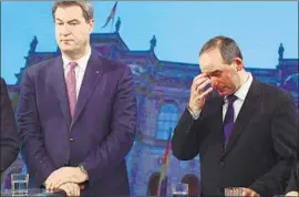  ?? Peter Kneffel AFP/Getty Images ?? BAVARIAN leader Markus Soeder, left, appears on TV with Hubert Aiwanger of the Free Voters party, which Soeder’s Christian Social Union may partner with.