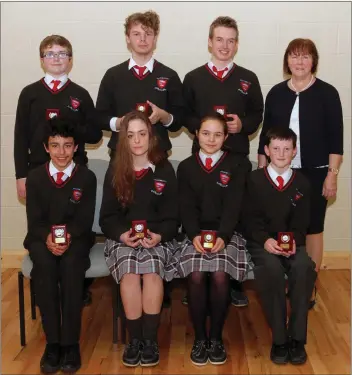  ??  ?? Attendance award winners, back row: Ethan Darcy, Marc Bolton Lee, Fionn McSiúrdáin amd principal Norah Harpur; front: Ryan Asgharian, Claudia Morris Nolan, Sonia Milbourne and Aaron Jackman.