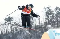  ?? PHOTOS: GETTY IMAGES ?? Flying Kiwis . . . New Zealanders Jackson Wells (above) and Finn Bilous (right) compete in the men’s ski slopestyle yesterday.