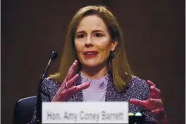  ?? MICHAEL REYNOLDS — POOL ?? Supreme Court nominee Amy Coney Barrett speaks Wednesday during a confirmati­on hearing before the Senate Judiciary Committee on Capitol Hill in Washington.