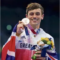  ?? ?? Tom Daley’s golden moment in Tokyo in 2021.