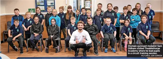  ?? PICTURES: JON CORKEN ?? Olympic gymnast medalist Sam Oldham visited Theddletho­rpe Academy where he lead pupils in a circuit training session.