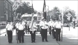  ?? Photo by Jake Mercer ?? THE SERVICEMEN’S DETAIL LINING UP TO WALK DOWN MARKET STREET PRIOR TO THE BEGINNING OF the Johnsonbur­g Memorial Day service.