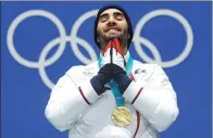  ?? ERIC GAILLARD / REUTERS ?? Martin Fourcade of France savors the moment after winning his third gold medal in Pyeongchan­g.