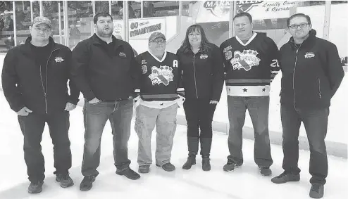  ??  ?? Kimberley Dynamiters fans were first introduced to would-be donor Mike Gould, second from left, of Calgary, on Oct. 13 during a pre-game ceremony.