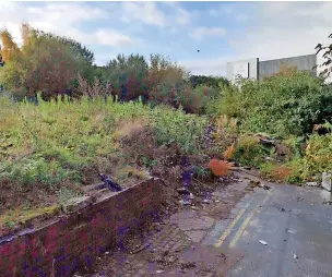  ?? ?? DERELICT: The plot of land off Marsh Street North where flats could be built.