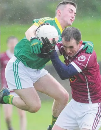  ??  ?? Dean Stanfield, O’Connell’s, is challenged by Anthony Battersby, Curraha.