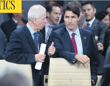  ?? ADRIAN WYLD / THE CANADIAN PRESS FILES ?? Prime Minister Justin Trudeau and Stéphane Dion, then-minister of Foreign Affairs, confer during the NATO summit in Warsaw in July 2016. The two had a long history of animosity, according to a recent book by Jocelyn Coulon.