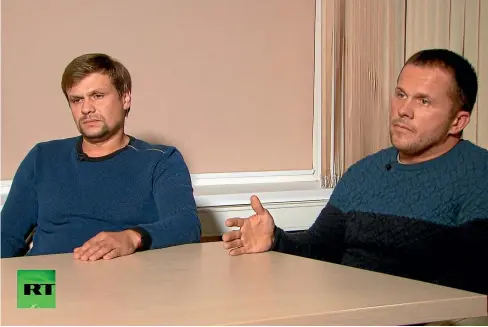  ?? AP ?? Ruslan Boshirov, left, and Alexander Petrov attend their first public appearance in an interview with the Kremlin-funded RT channel in Moscow. The two men, charged in Britain with poisoning a former Russian spy with a deadly nerve agent, appeared on Russian television this week, saying they visited the suspected crime scene as tourists.