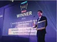  ??  ?? ArthaLand treasurer, Leo Po, receives the trophy from the South East Asia Property Awards 2016.