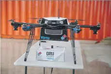  ?? DOMINO’S PIZZA. ?? Domino’s pizza delivery by air uses a Flirtey DRU Drone.