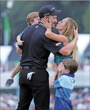  ?? SETH WENIG/ AP ?? Jimmy Walker gets a kiss from his wife Erin after winning the PGA Championsh­ip at Baltusrol Golf Club in Springfiel­d, New Jersey, on Sunday.