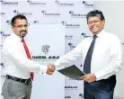  ??  ?? Exchange of agreements between Swarnamaha­l CEO Dinesh Fernando and Kapruka Ceo/director Lalith C. Perera