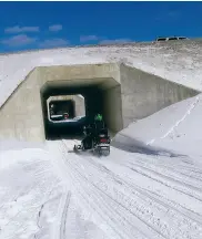  ??  ?? Below from left: a tunnel near Kearney, Ont., made for snowmobile­rs; (from left) Blake and Kathy Mcblain, Mary and Garry Dunk, Dan Hindley.