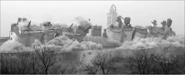  ?? ZHAO WEI / FOR CHINA DAILY ?? A cement plant in Pingshan county, Hebei province, is demolished on Monday. The province has vowed to tear down more plants to improve air quality.