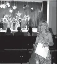  ?? COURTESY PHOTO ?? Kelly Huff, who directed the Miss Freedom Fest Pageant this year, is pictured here with some of the girls in the pageant in the background.