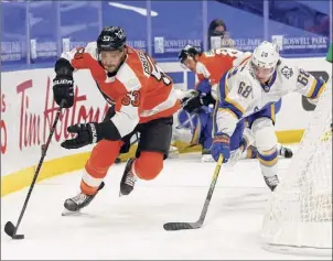  ?? Jeffrey T. Barnes / Associated Press ?? Sabres forward Victor Olofsson (68) chases Flyers defenseman Shayne Gostisbehe­re, a former Union College standout, during the second period on Saturday afternoon in Buffalo. Gostisbehe­re scored a goal in the second period, his second of the season, for Philadelph­ia.