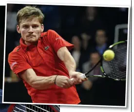  ?? AFP ?? Bouncing back: Goffin hits a backhand on his way to victory and (below) Andy Murray’s wife Kim and cousin Josh show their support on day one