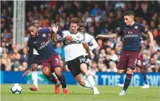  ?? AFP ?? Fulham striker Luciano Vietto vies with Arsenal striker Alexandre Lacazette and midfielder Lucas Torreira, yesterday.