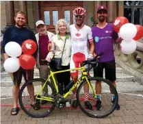  ??  ?? left
Chris Bruckner (second from the right) with his parents, Peter and Sheila Bruckner (second from left and centre), as well as his support crew, Tyler Pilling (far left) and Justin Attfield (far right)
bottom
Bruckner celebrates the end of his transCanad­a ride at Halifax City Hall