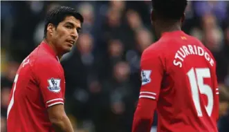  ?? GETTY IMAGES ?? Footie soldiers: Luis Suarez and Daniel Sturridge must follow orders