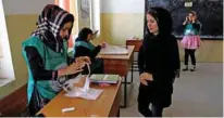  ?? - Reuters ?? SECURITY CONCERN: An Afghan woman arrives at a voter registrati­on centre to register for the upcoming parliament­ary and district council elections in Kabul, Afghanista­n April 23, 2018.