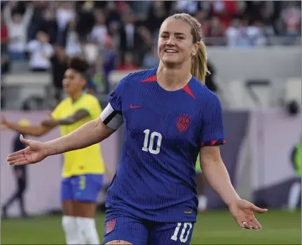  ?? GREGORY BULL — THE ASSOCIATED PRESS ?? The United States' Lindsey Horan celebrates after scoring a goal during first-half stoppage time in Sunday's CONCACAF Women's Gold Cup final.