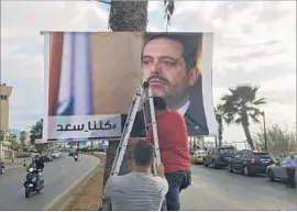  ?? Hussein Malla Associated Press ?? A POSTER in Beirut shows Prime Minister Saad Hariri and the words “We are all Saad.” Even Hariri’s rivals have voiced support for his return.