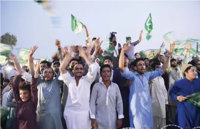  ?? AFP ?? Supporters of Shahbaz Sharif, the head of Pakistan Muslim League-Nawaz (PML-N), dance and cheer to songs during an election campaign rally in Pindi Gheb in Punjab province. —