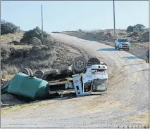  ?? Picture: RANDELL RUSKRUGE ?? DANGEROUS SLOPE: A truck overturned in Kwetyana just outside East London allegedly because of the state of the road