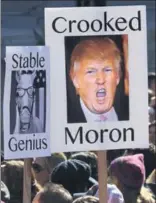  ?? AFP/AP ?? (Above) Protesters take to the streets to the streets of Los Angeles to protest against Donald Trump; (top right) Participan­ts of the Women’s March gather near the Lincoln Memorial in Washington; (bottom right) People look towards the Statue of Liberty...