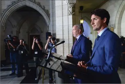  ?? SEAN KILPATRICK, THE CANADIAN PRESS ?? Prime Minister Justin Trudeau holds a press conference with Premier of British Columbia John Horgan following their meeting in Ottawa on Tuesday.